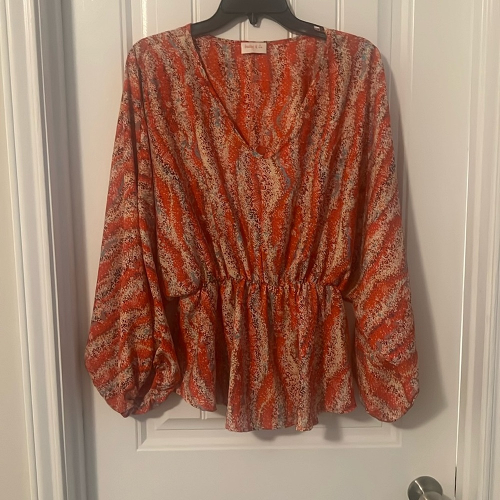 V-neck over sized blouse.